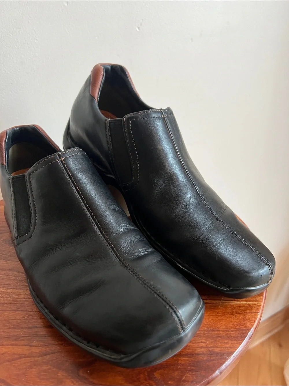 Cole Haan Black Leather Slip-On Loafers with Brown Heel Detail